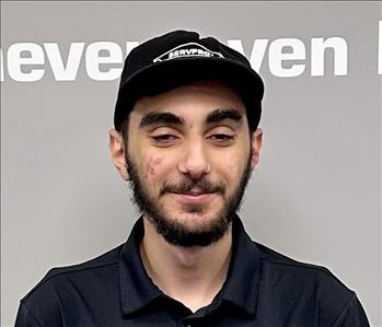 Young man with dark hair and a servpro shirt