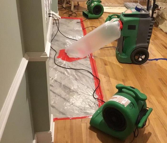 servpro equipment being used to ventialte and dry a room