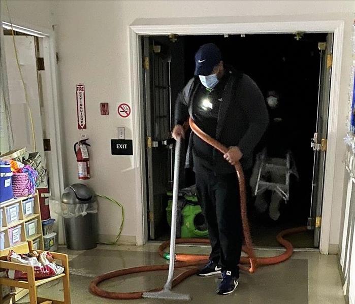 servpro technician vacuuming water
