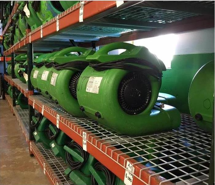 green drying machines on a shelf