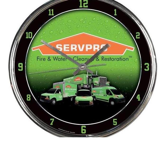 Clock with servpro logo on it