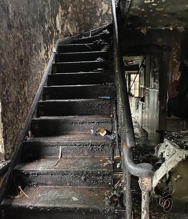 house with fire damaged stairwell